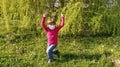 Girl 6 years old in a long sleeve fuchsia or hot pink. The child wears a white protective surgical mask. Prevention of airborne Royalty Free Stock Photo