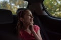 A girl of 8-10 years old rides in a car. Exploring nature, travel, family vacation. A girl of 9 years old rides in a car Royalty Free Stock Photo