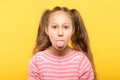 Girl sticking tongue out cute antics frolicking Royalty Free Stock Photo