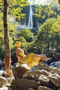 Girl with a yellow dress in the nature