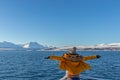 Girl in yellow Enjoying a fjords cruise