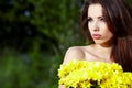 Girl with yellow flowers smiling