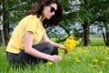 Girl and yellow flowers. Travel outside the city. Wildlife. Summer time Royalty Free Stock Photo