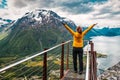 Girl in yellow jacked on rampestreken in Norway Royalty Free Stock Photo