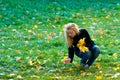 Girl with yellow leaves Royalty Free Stock Photo