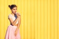 Girl on a yellow wall background Royalty Free Stock Photo