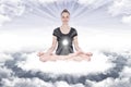 Girl in yoga lotus position on the clouds between the spokes of