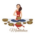 Girl yoga meditates with Tibetan singing bowls. Woman plays music. Relaxation after yoga. Enlightenment with deep music. Royalty Free Stock Photo