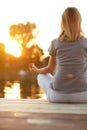 Girl in yoga pose - back view Royalty Free Stock Photo