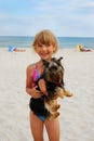 Girl with yorkshire dog on the beach Royalty Free Stock Photo