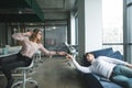 girl and the young man made a parody of the painting The Creation of Adam in the office