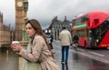 Woman Drinking Coffee on Westminster Bridge, Big Ben, London, England Royalty Free Stock Photo