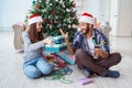 The girlfriend and boyfriend opening christmas gifts Royalty Free Stock Photo