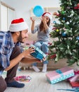 Girlfriend and boyfriend opening christmas gifts Royalty Free Stock Photo