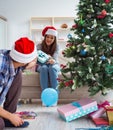 Girlfriend and boyfriend opening christmas gifts Royalty Free Stock Photo