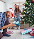 Girlfriend and boyfriend opening christmas gifts Royalty Free Stock Photo