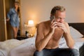 Girlfriend caught her cheating boyfriend while he`s on phone with another woman Royalty Free Stock Photo
