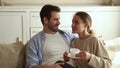 Girlfriend drink tea enjoy dating with beloved man at home