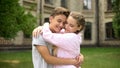 Girlfriend hugging teen boyfriend, loving relationship, tender emotions, date