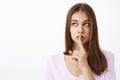 Girlfriend telling secret to friend feeling worried boyfriend find out showing shush gesture while saying shh with index