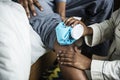 A girlfriend treating a boyfriend`s injured leg Royalty Free Stock Photo