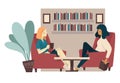 Girlfriends drink tea and talking in home library