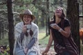 Girlfriends drinking coffee on nature in the country. Folk style