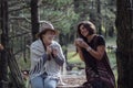 Girlfriends drinking coffee on nature in the country. Folk style