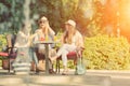 Girlfriends enjoying cocktails in an outdoor cafe, friendship concept Royalty Free Stock Photo