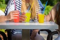 Girlfriends enjoying cocktails in an outdoor cafe, friendship concept Royalty Free Stock Photo