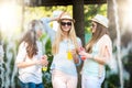 Girlfriends enjoying cocktails by a water fountain