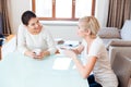 Girlfriends gossiping in the kitchen Royalty Free Stock Photo