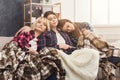 Girlfriends sleeping together on the sofa at home Royalty Free Stock Photo