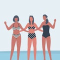 Girlfriends in swimsuits stand against the background of the sea. Three young women in beach suits stand together Royalty Free Stock Photo