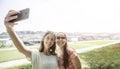 Girlfriends taking selfie together having fun outdoors concept of modern women friendship lifestyle female best friends happy Royalty Free Stock Photo