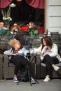 Girlfriens talking sitting in the outdoor coffee bar, Trieste