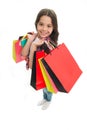 Girlish happiness. Kid girl happy smiling face carries bunch packages white background. Birthday girl concept. Girl
