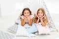 Girlish leisure. Sisters friends share gossips having fun at home. Pajamas party for kids. Siblings best friends Royalty Free Stock Photo