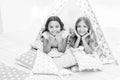 Girlish leisure. Sisters friends share gossips having fun at home. Pajamas party for kids. Siblings best friends Royalty Free Stock Photo