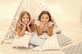 Girlish leisure. Sisters friends share gossips having fun at home. Pajamas party for kids. Siblings best friends Royalty Free Stock Photo