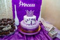 Girlish purple cake with crown and inscription - name Katusha is 1 year old. First birthday party. Royalty Free Stock Photo