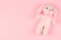 Girlish soft toy on a pink gentle background