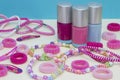 Girlish teenager room, place for makeup at home. A group of colorful Nail Polish bottles, hair ribbons, bracelets, necklaces, hair