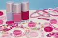 Girlish teenager room, place for makeup at home. A group of colorful Nail Polish bottles, hair ribbons, bracelets, necklaces, hair