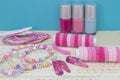 Girlish teenager room, place for makeup at home. A group of colorful Nail Polish bottles, hair ribbons, bracelets, necklaces, hair