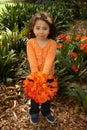 Girll with a bunch of clivia from the garden Royalty Free Stock Photo