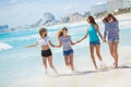 Girls amid a tropical beach. Royalty Free Stock Photo