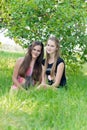 Girls in an apple orchard Royalty Free Stock Photo