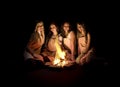 Girls around campfire Royalty Free Stock Photo