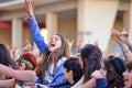 Girls from the audience in front of the stage, cheering on their idols at the Primavera Pop Festival of Badalona Royalty Free Stock Photo